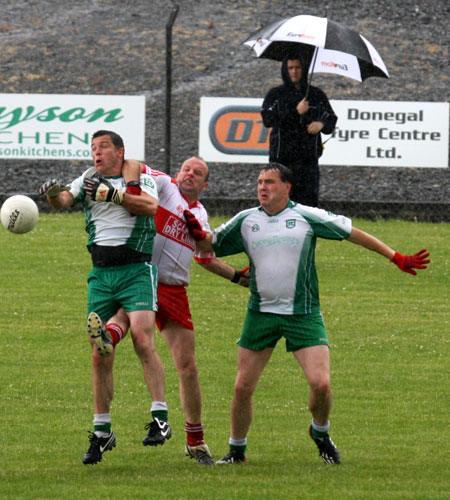 Action from the Junior B championship play-off against Glenfin.