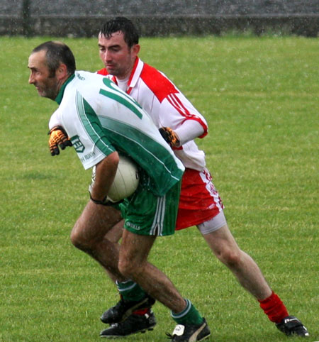 Action from the Junior B championship play-off against Glenfin.