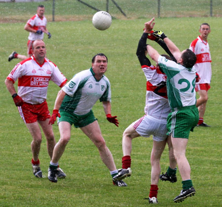 Action from the Junior B championship play-off against Glenfin.