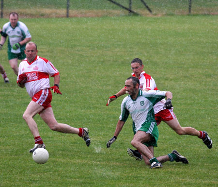 Action from the Junior B championship play-off against Glenfin.