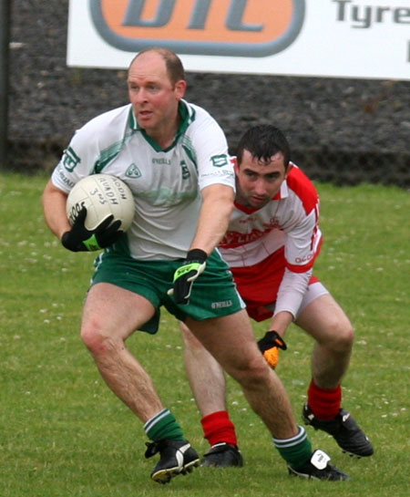 Action from the Junior B championship play-off against Glenfin.