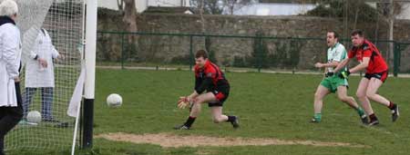 Action from the reserve senior division three match against Naomh Bríd.