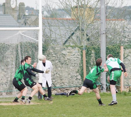 Action from the reserve senior division three match against Naomh Bríd.