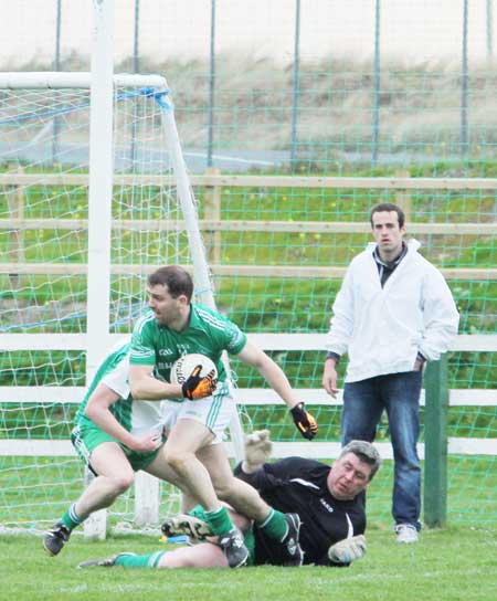 Action from the senior division three match against Naomh Mhuire.