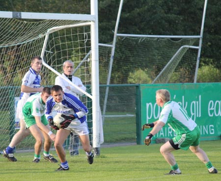 Action from the intermediate championship play-off match against Fanad Gaels.