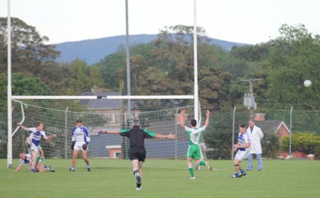 Action from the intermediate championship play-off match against Fanad Gaels.