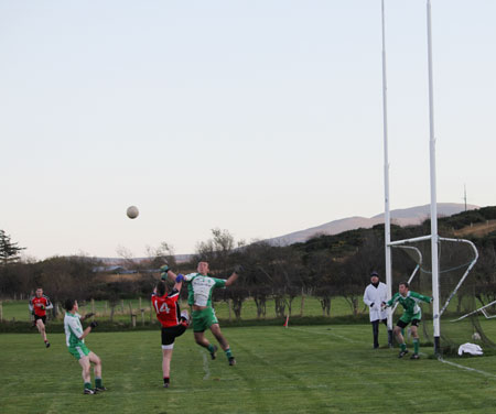 Action from the division three football league match against Urris.