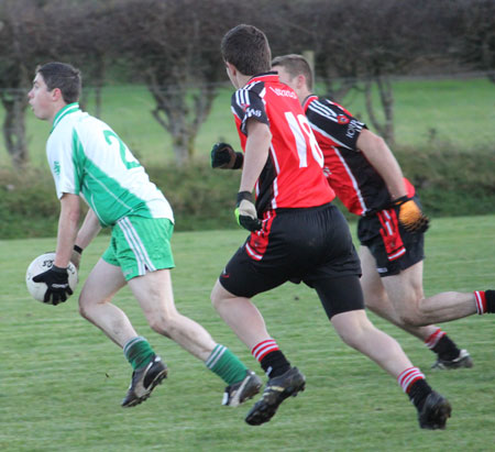 Action from the division three football league match against Urris.