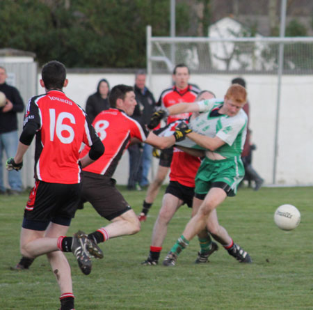 Action from the division three football league match against Urris.