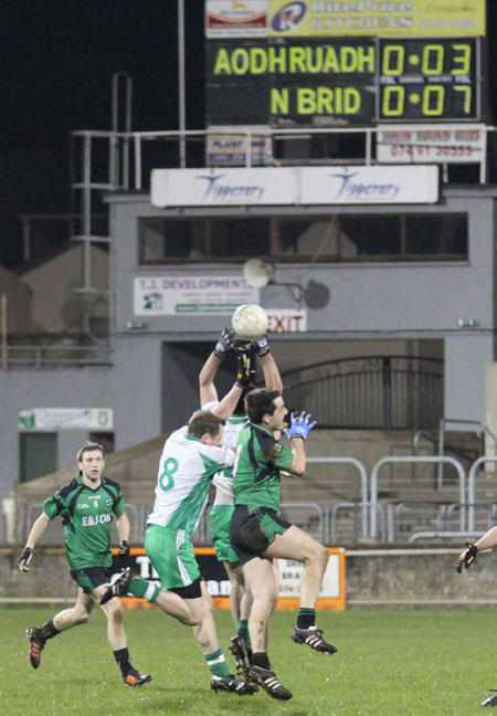 Action from the division three football league play-off match against Naomh Bríd.