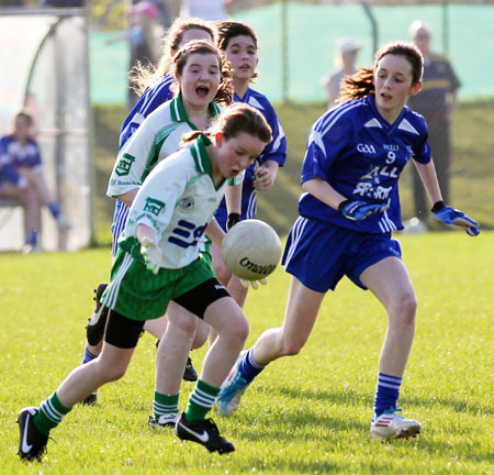 Action from the 2012 ladies under 14 match between Aodh Ruadh and Four Masters.