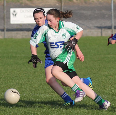 Action from the 2012 ladies under 14 match between Aodh Ruadh and Four Masters.
