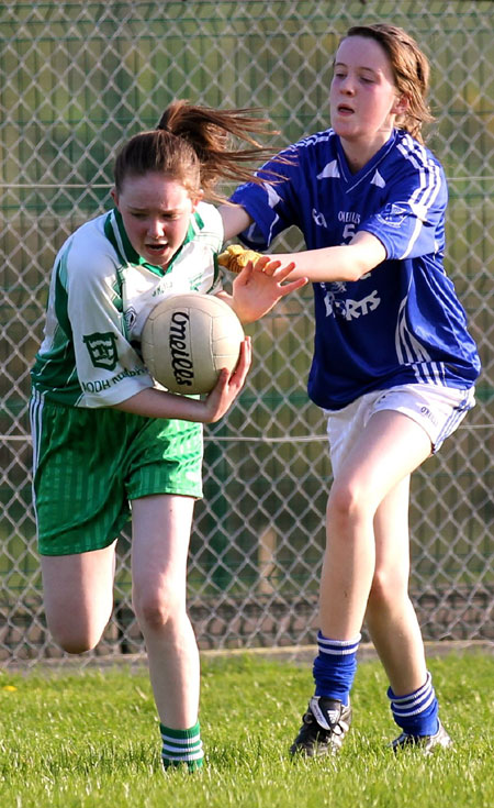 Action from the 2012 ladies under 14 match between Aodh Ruadh and Four Masters.