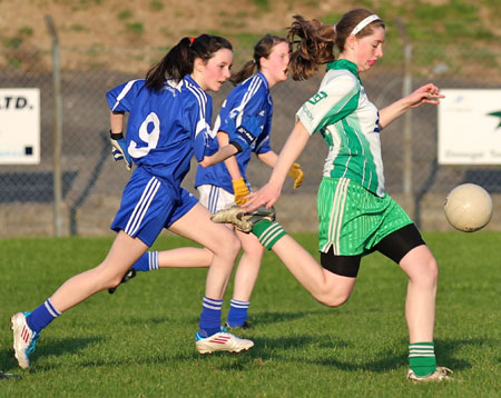 Action from the 2012 ladies under 14 match between Aodh Ruadh and Four Masters.