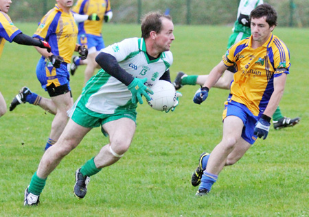 Action from the division three senior football league match against Burt.