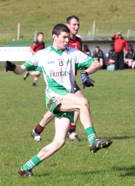 Action from the intermediate reserve football championship game against Naomh Bríd.