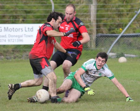 Action from the intermediate reserve football championship game against Naomh Bríd.