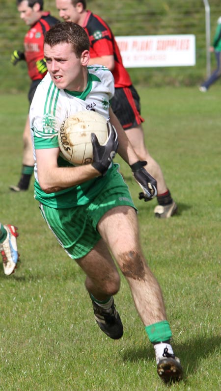 Action from the intermediate reserve football championship game against Naomh Bríd.