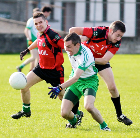 Action from the intermediate reserve football championship game against Naomh Bríd.