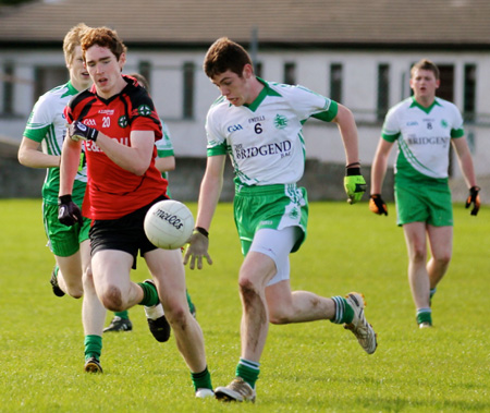 Action from the intermediate reserve football championship game against Naomh Bríd.