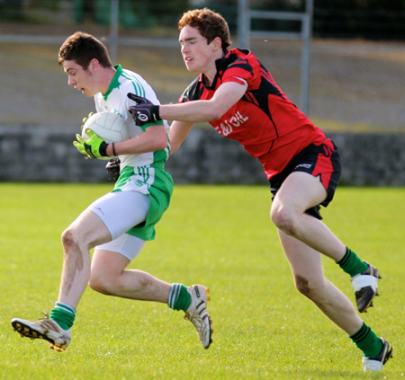 Action from the intermediate reserve football championship game against Naomh Bríd.