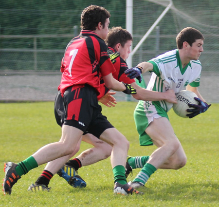 Action from the intermediate reserve football championship game against Naomh Bríd.