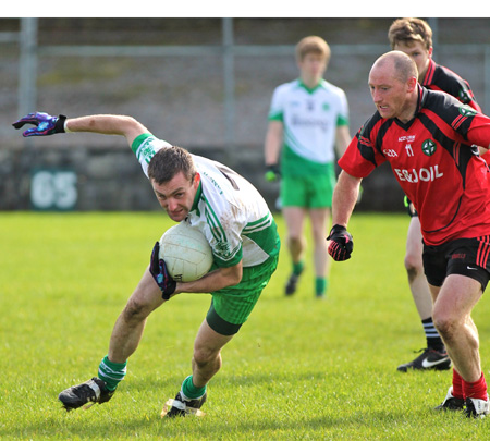 Action from the intermediate reserve football championship game against Naomh Bríd.