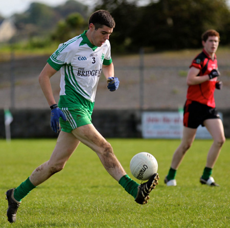 Action from the intermediate reserve football championship game against Naomh Bríd.