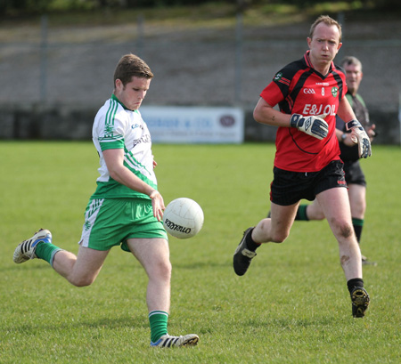 Action from the intermediate reserve football championship game against Naomh Bríd.