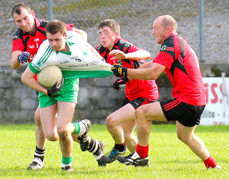 Action from the intermediate reserve football championship game against Naomh Bríd.