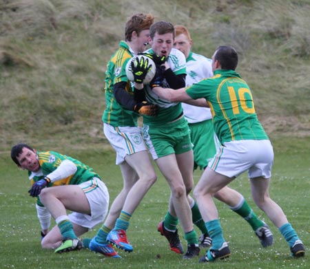 Action from the division three senior football league match against Downings.