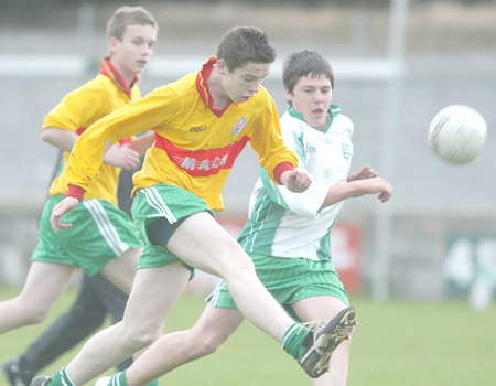 Kieran Storey closing in on Kieran Keown as Alan Finan offers back-up.