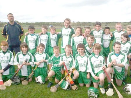 Aodh Ruadh under 12 hurlers with their manager Michael Ayres before their game against Ballycastle.