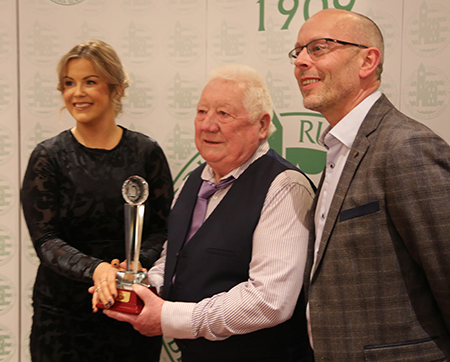 Club Secretary Louise Larkin and Club Treasurer William Doogan presenting the Hall of Fame award to Jim Kane.