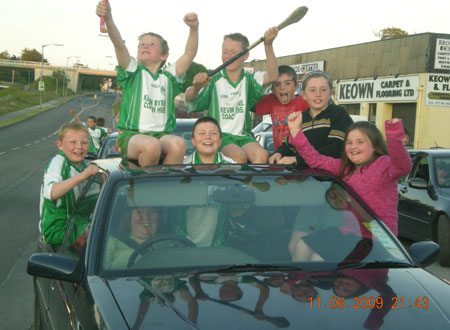 Aodh Ruadh players and supporters at the start of their victory cavalcade.