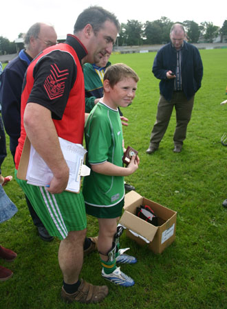 Winner of the under 12 skills tournament held on Sunday 23rd September in Father Tierney Park. Jamie Brennan with tournament organiser John Rooney.