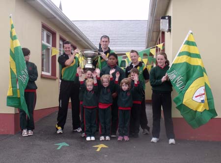 Students of Gaelscoil Eirne give the boys and Lory Meagher a great welcome.