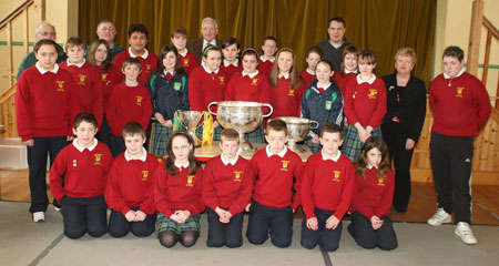 Pupils from Scoil Catriona National School, Ballyshannon pictured with the Sam Maguire, Tom Markham (All-Ireland minor football championship) and McKenna cups when they visited their school last Friday.