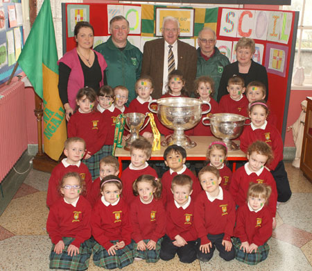Pupils from Scoil Catriona National School, Ballyshannon pictured with the Sam Maguire, Tom Markham (All-Ireland minor football championship) and McKenna cups when they visited their school last Friday.