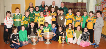 Pupils from Creevy National School, Ballyshannon pictured with the Sam Maguire, Tom Markham (All-Ireland minor football championship) and McKenna cups when they visited their school last Friday.