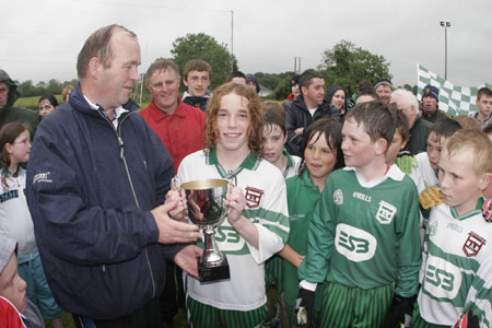 Pauric Patton is presented with the under 12 county trophy.