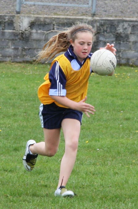 The underage girls footballers are put through their paces.