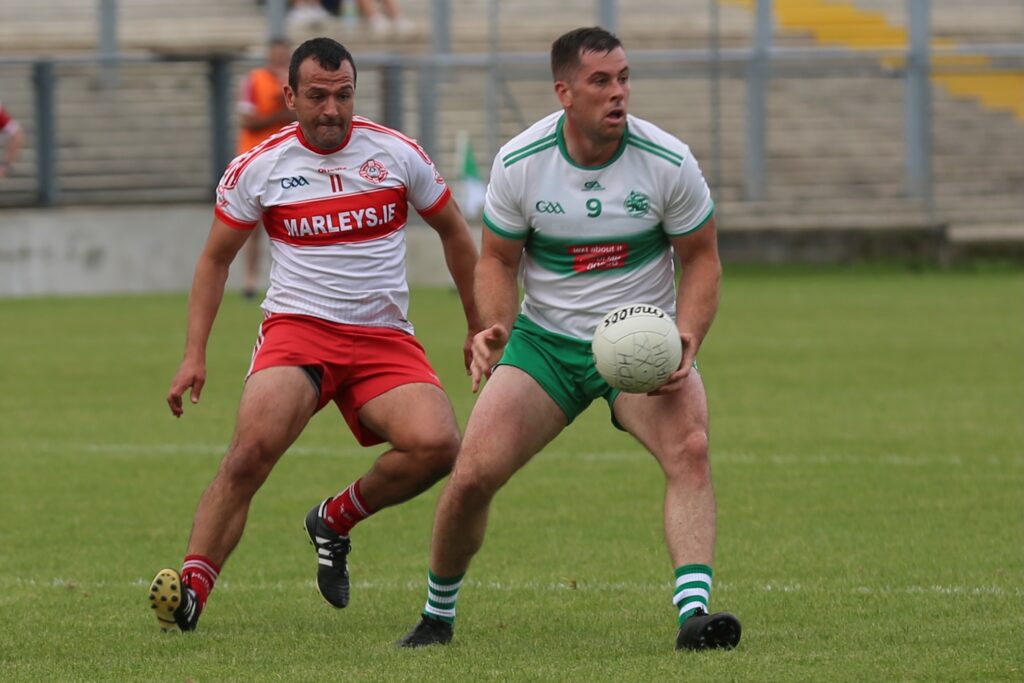 Cian Dolan is shadowed by Glenfin's Frank McGlynn.